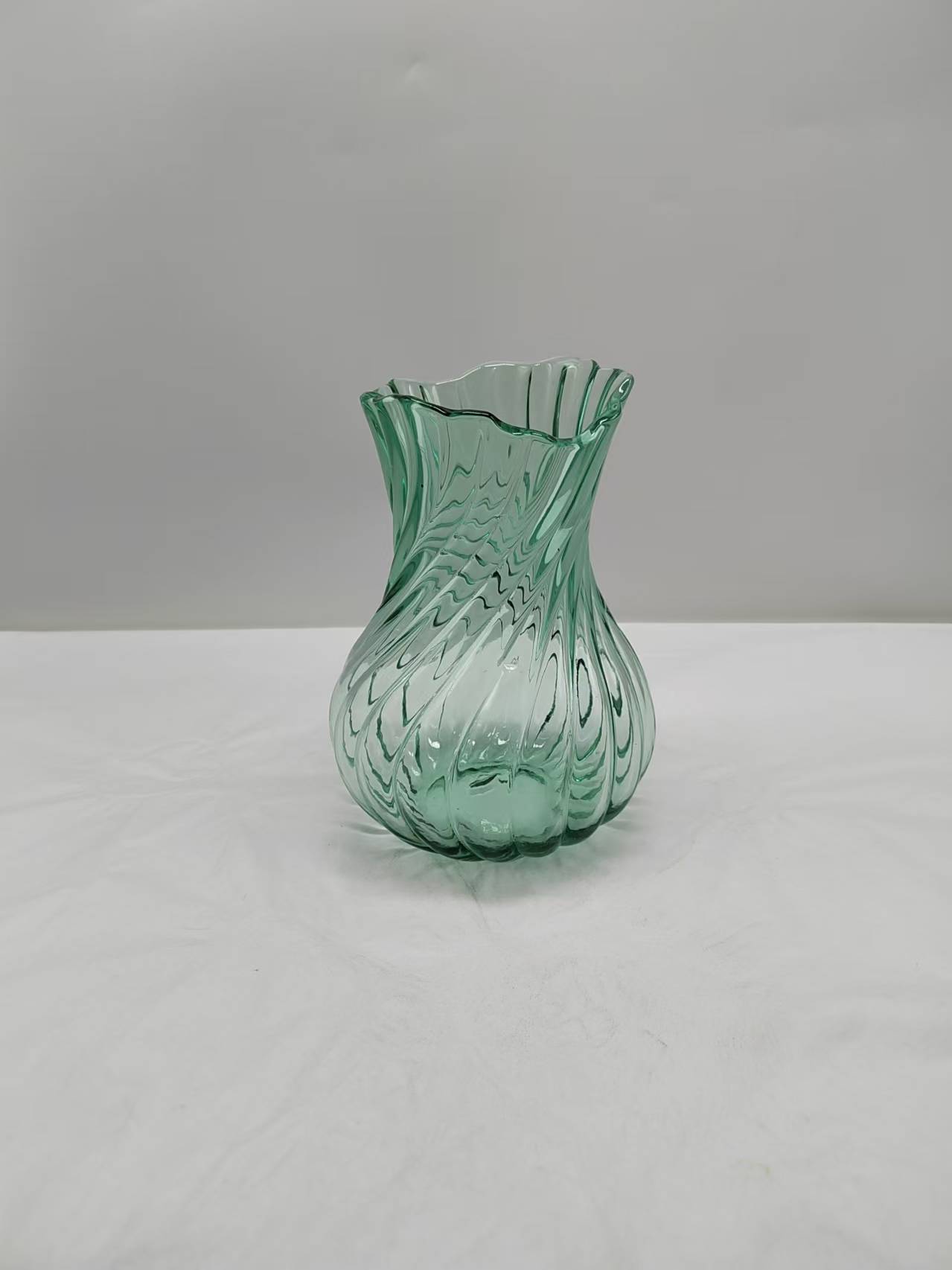 Green glass vase in primary color